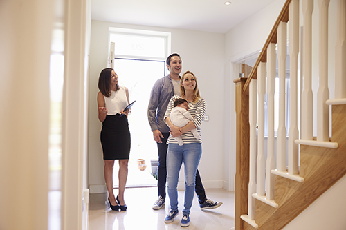 image of real estate image showing a family a home.