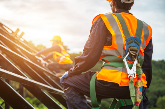 Fall protection - roofer wearing safety harness