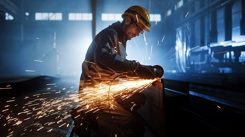 Metal worker cutting steel